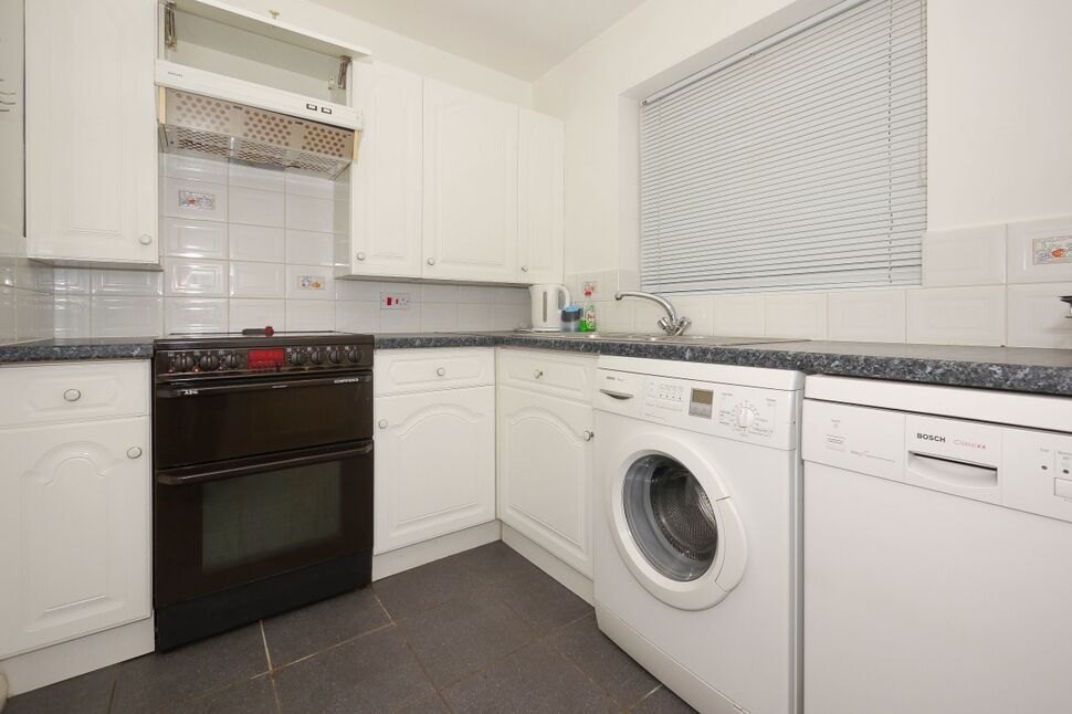 Well Appointed Kitchen With Cooker Washing Machine And Dishwasher