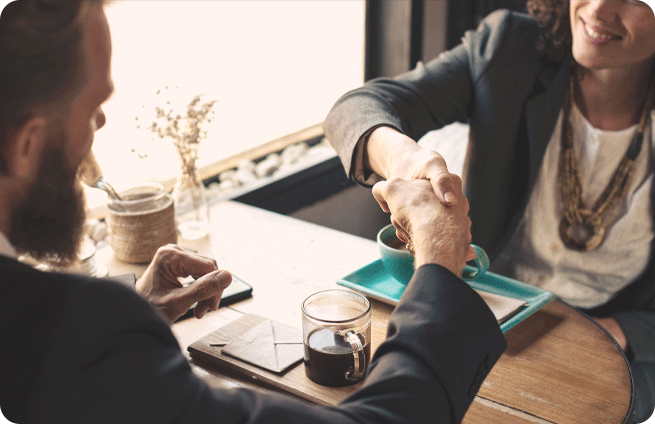 A letting agent shaking hands with a landlord