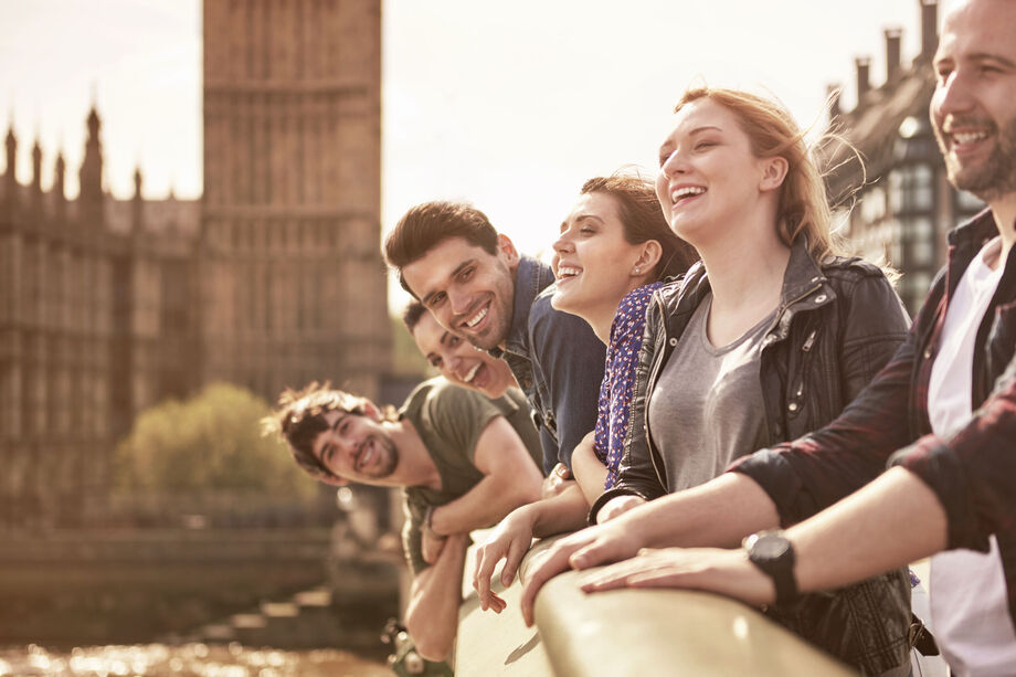 Group of people smiling towards the camera