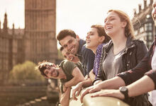 Group of people smiling towards the camera