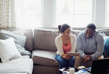 Couple sat on a sofa