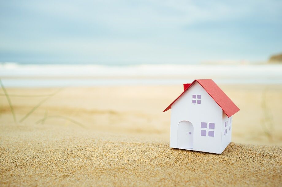 Minature house on a beach