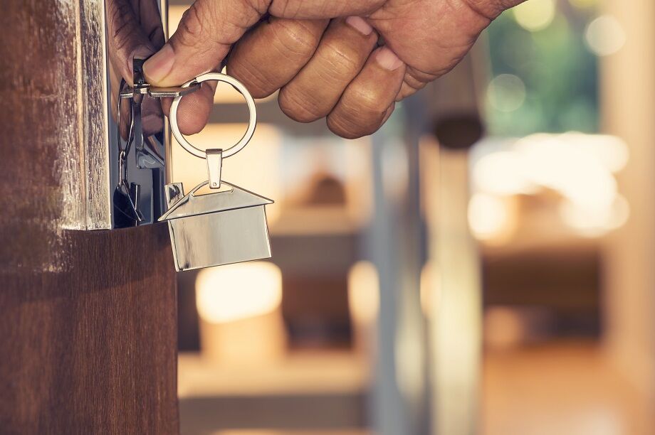 Man opening door with a key