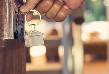 Man opening door with a key