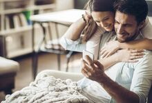 Couple looking at laptop