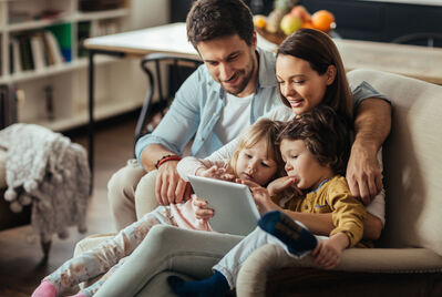 Family looking at a tablet computer