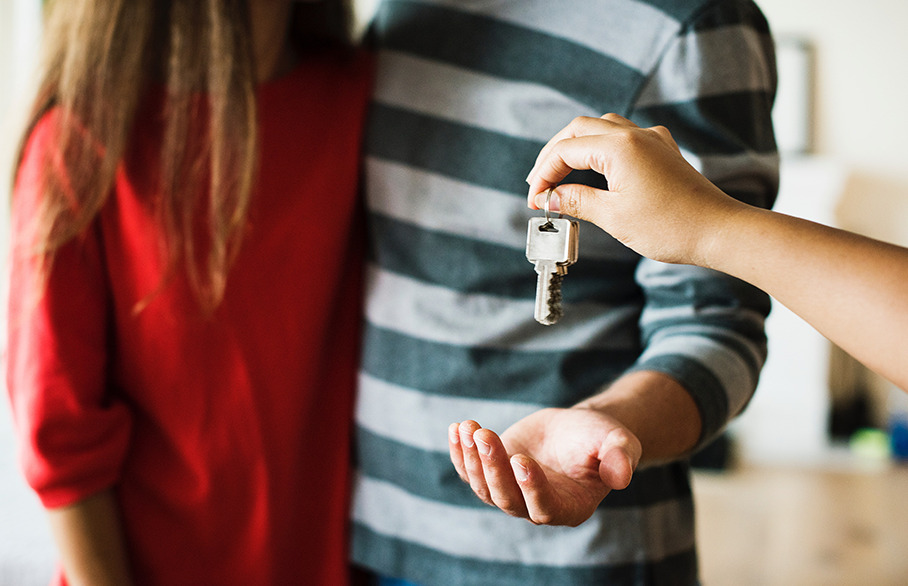 Couple being handed keys