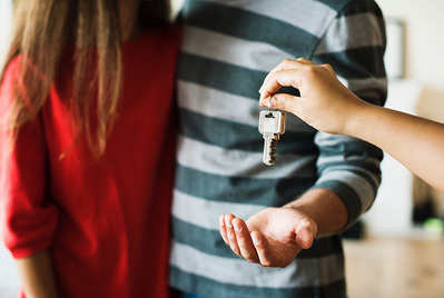 Couple being handed keys