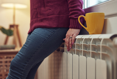Leaning against a radiator