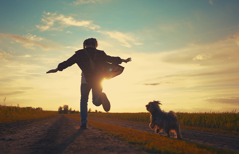Girl and her dog running