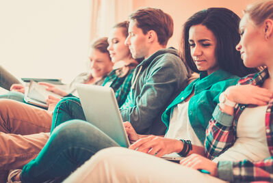 Students on a couch relaxing
