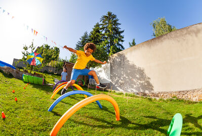 Children running and playing in a park