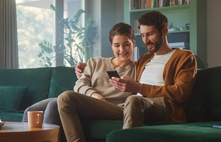 Two people relaxing on a couch together