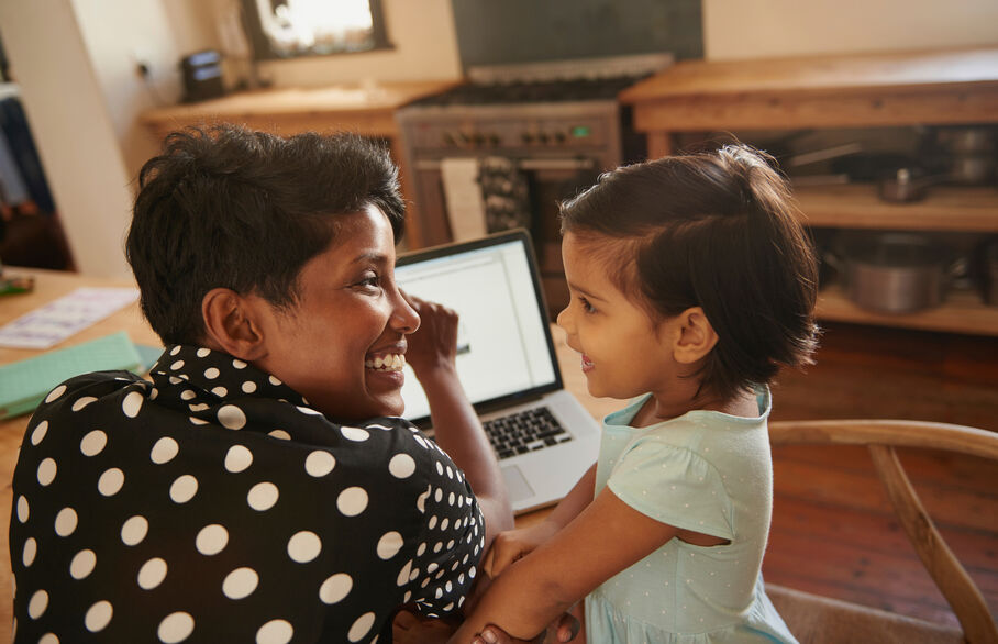 women and child looking at ipad 