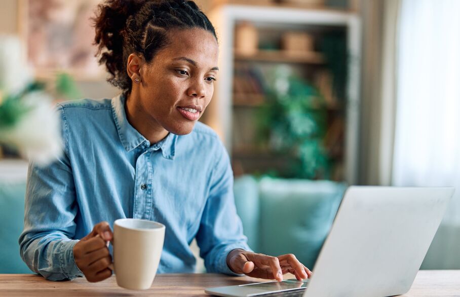women with coffee and laptop 