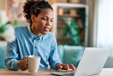 women with coffee and laptop 