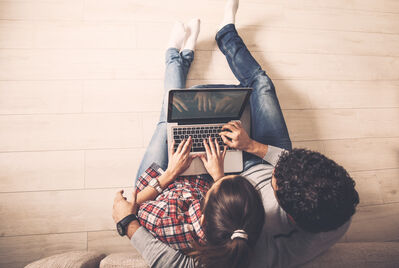 two people on laptop