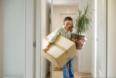 Person carry a box and plant