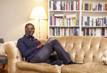 Tenant on sofa reading