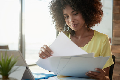 Woman looking through papers