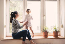 Mum and child at the window