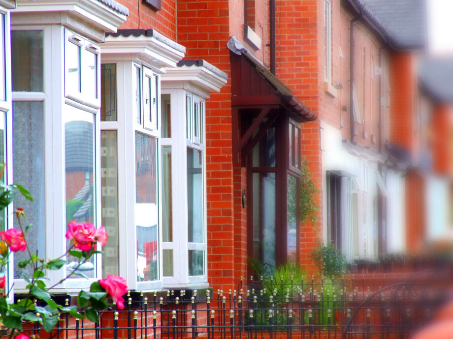 Row of terraced red brick houses