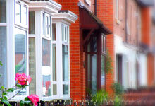 Row of terraced red brick houses