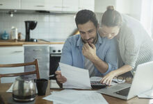 Couple looking at laptop