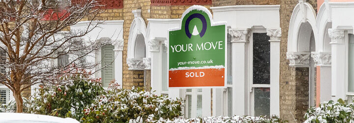 Your Move Sold Board outside a snowy terraced road