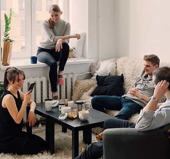Students talking in a living room